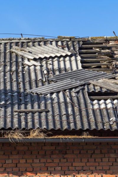 Damaged asbestos roofing material